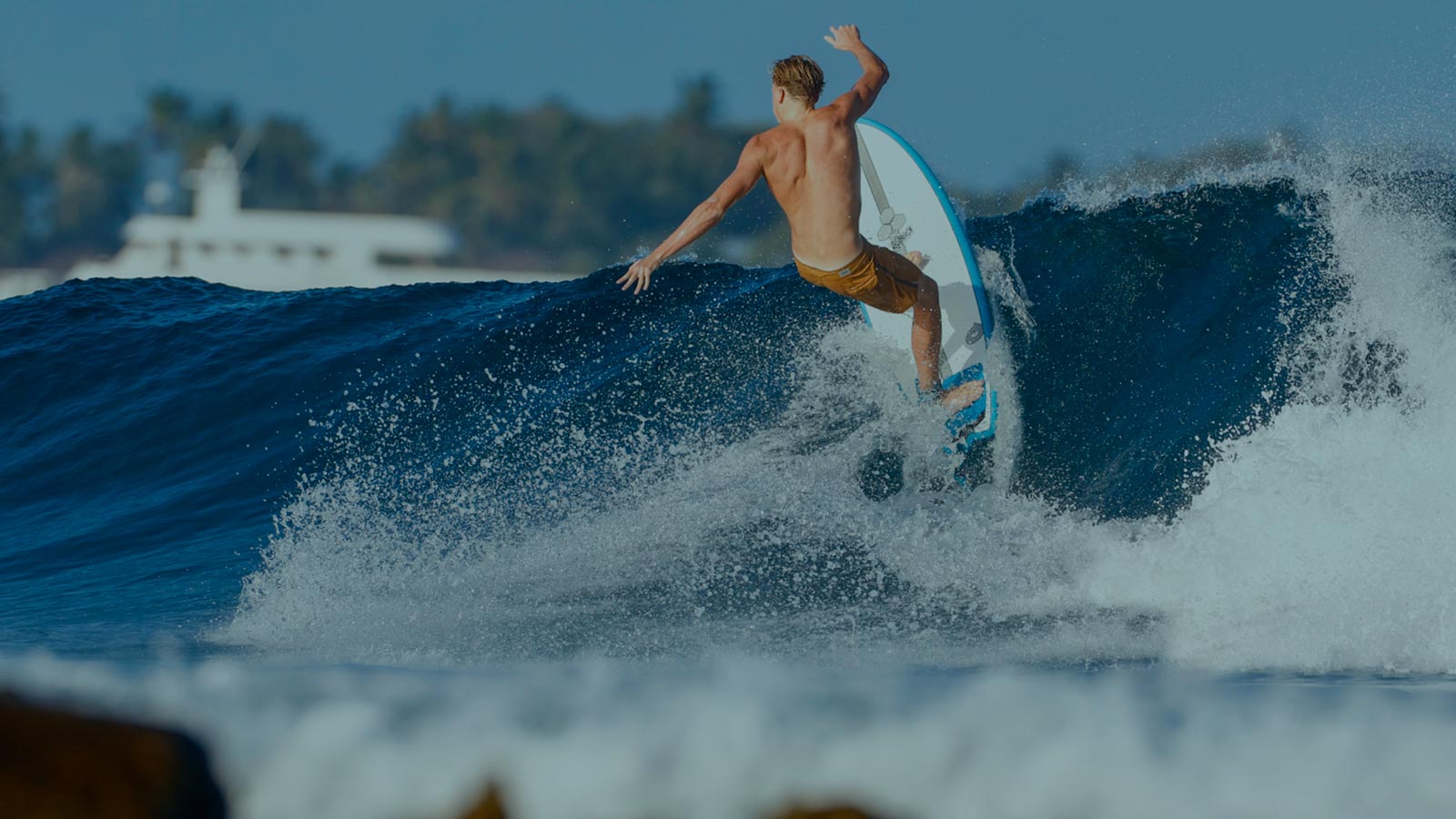 Channel Islands surfboard rider carving a powerful wave with precision and style