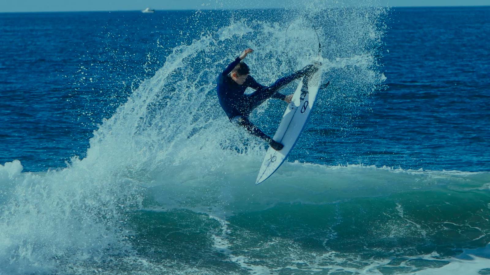 Firewire Surfboards Rider Performing a Powerful Turn on an Ocean Wave