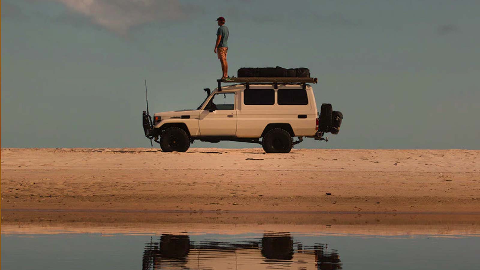 Truck with surfboard bags on the roof. Your surfboard is not just equipment — it’s a finely tuned, slightly fragile, wave-hunting companion. It’s surprisingly sensitive when it comes to transporting.