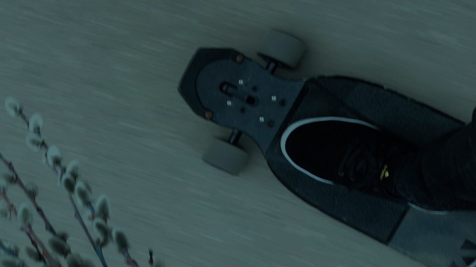 Skateboard, Surfskate and longboard Wheels. Feet on a longboard charging on the concrete.